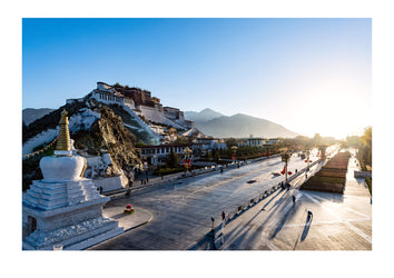 The towering facade, shield wall and bastions of the Potala Palace overlooking the Himalaya at dawn. Lhasa, Tibet Autonomous Region, Tibet