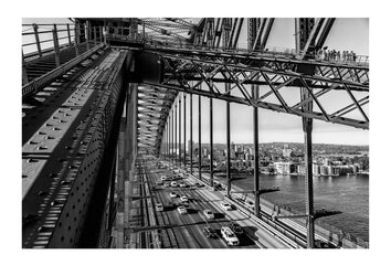Traffic passing beneath the iconic steel beams and arch of the Sydney Harbour Bridge. Sydney, New South Wales, Australia.